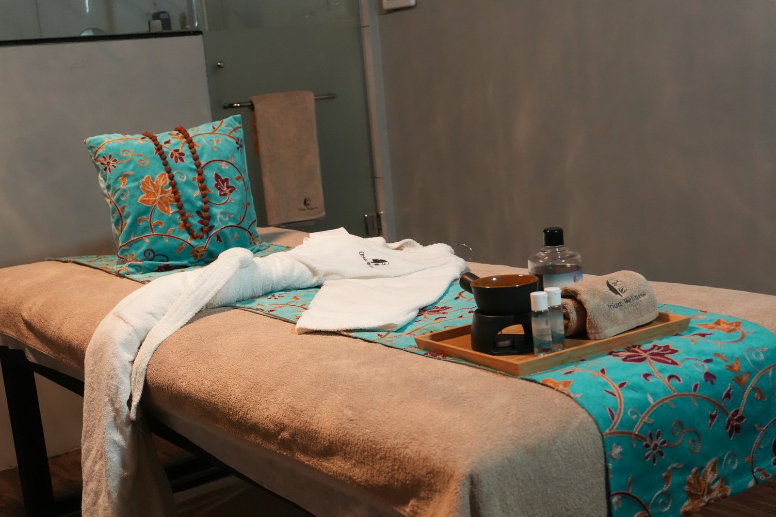 Tranquil therapy room with warm ambient lighting at Orion Wellness Spa Bangalore